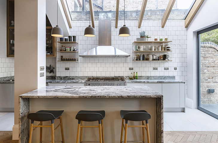 Contemporary open plan kitchen with integrated dining space and natural light